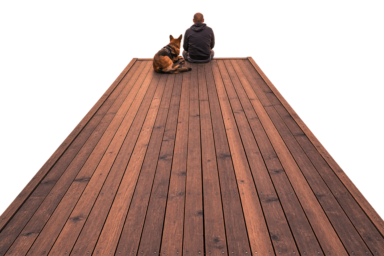 Person and dog sitting together on a dock